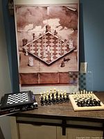 Group view of poster, Saitek computer box, wooden board with pieces
