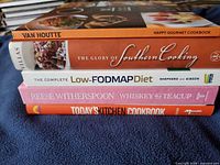Stacked spines showing all five cookbook titles and formats