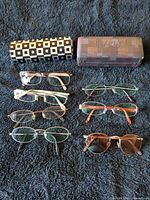 Full lot view showing six pairs of glasses and two cases