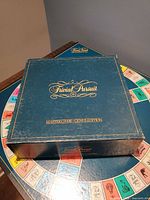 Closed Trivial Pursuit box on game board