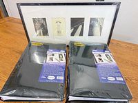 Two sealed Pioneer albums and multi-opening frame displayed together