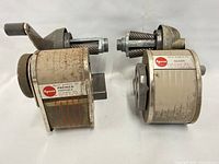 Both Apsco sharpeners side-by-side showing model labels and overall wear