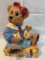 Front view of ceramic bear cookie jar showing colors, design, and overall condition