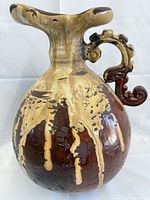 Full view of vase showing body, handle, glaze pattern