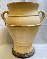 Front view showing full shape, handles and pedestal base