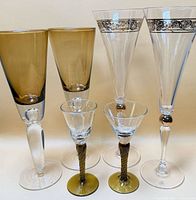 Front view of all six glasses showing sizes, colors, stems and gold trim