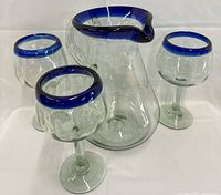 Pitcher front with three goblets displayed