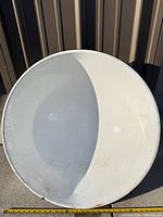 Top view of large white enamel basin showing interior wear