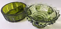 Both olive green glass pieces side by side showing form and color