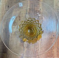 Top view showing clear bowl with amber spiral and Blenko label