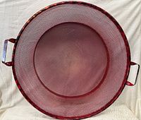 Top view showing round mesh sieve interior and handles