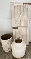 All three items grouped: barn door panel, ceramic planter, patterned bin