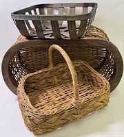 All three baskets stacked to show relative sizes and materials