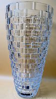 Full view of tall clear crystal vase with block texture