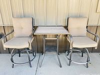 Full view of bistro set showing table and both chairs
