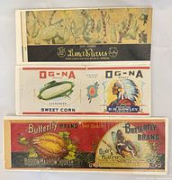 Front view of all three produce can labels showing graphics and branding