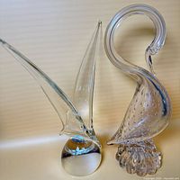 Both blown glass bird sculptures side by side