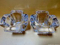 Front view of both clear crystal candle holders