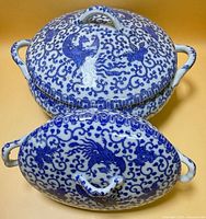 Top view of both covered tureens showing blue phoenix and floral pattern