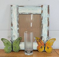 Group shot showing frame, vase, two butterfly hooks