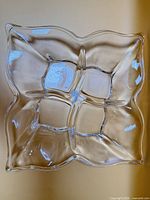 Top view showing four compartments and scalloped rim