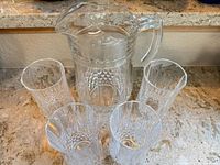 Front view of pitcher with four matching tumblers