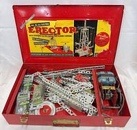 open case showing full contents including metal parts, motor, hardware