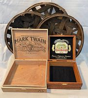 All items together – two open cigar boxes in front, three round woven baskets standing behind