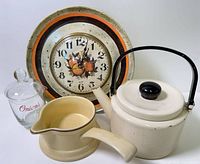 Group shot of all four items: enamel teapot, Spartus clock plate, Pfaltzgraff gravy boat, glass "Onions" jar