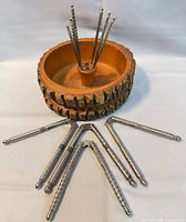 wood bowl with bark edge, centre holder and metal tools