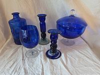 Front view of all five cobalt blue glass pieces