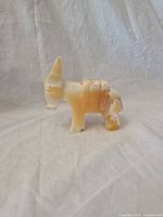 Left side view of polished stone donkey