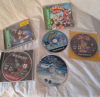 All six game discs and three cases laid out
