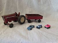 Group shot of tractor, trailer and three cars