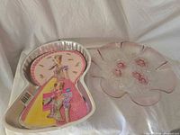 Cake pan with insert and pressed glass plate side by side