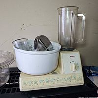 Mixer base with bowl, blender jar, discs visible