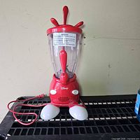 Full view of smoothie maker showing base, pitcher and power cord