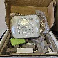 Panel, power adapter, battery pack inside original box