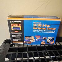 Front of Linksys EZXS88W boxed switch