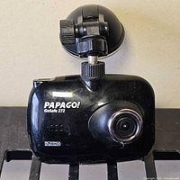 Front of PAPAGO! GoSafe 272 dashcam showing lens and branding, suction mount visible