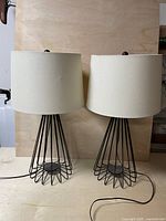 Front view of both matching wire frame table lamps with shades