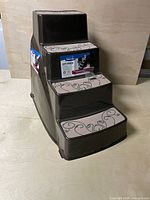 Front angled view showing three steps, tread surfaces and product label