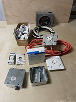 Group shot of all electrical components including meter socket, receptacles, breakers, boxes and cables