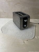 Toaster sitting on translucent pebble-pattern mat