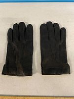 Gloves front view showing three darts and leather texture