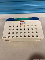 Closed Design & Drill carrying case showing perforated top