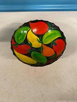 Top view showing fruit design and scalloped rim