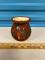 Front view showing homestead scene, scale ruler