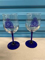 Both RCMP blue-stem wine glasses front view