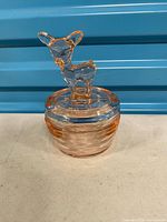 Complete lidded dish showing deer finial